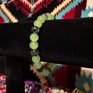 Hand made, green on black, beaded bracelet!